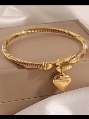 Gold Twisted Cable Bangle with Heart Charm